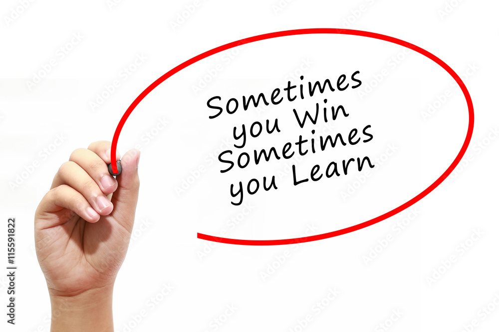 Man Hand writing Sometimes you Win Sometimes you Learn with marker on transparent wipe board. Business, internet, technology concept. Man Hand writing Sometimes you Win Sometimes you Learn with marker on transparent wipe board. Business, internet, technology concept.