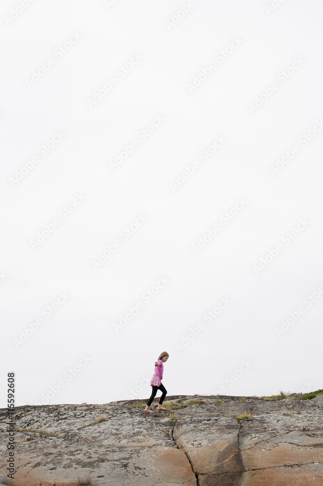 Sweden, Halland, Onsala, Girl (6-7) walking on hill Sweden, Halland, Onsala, Girl (6-7) walking on hill