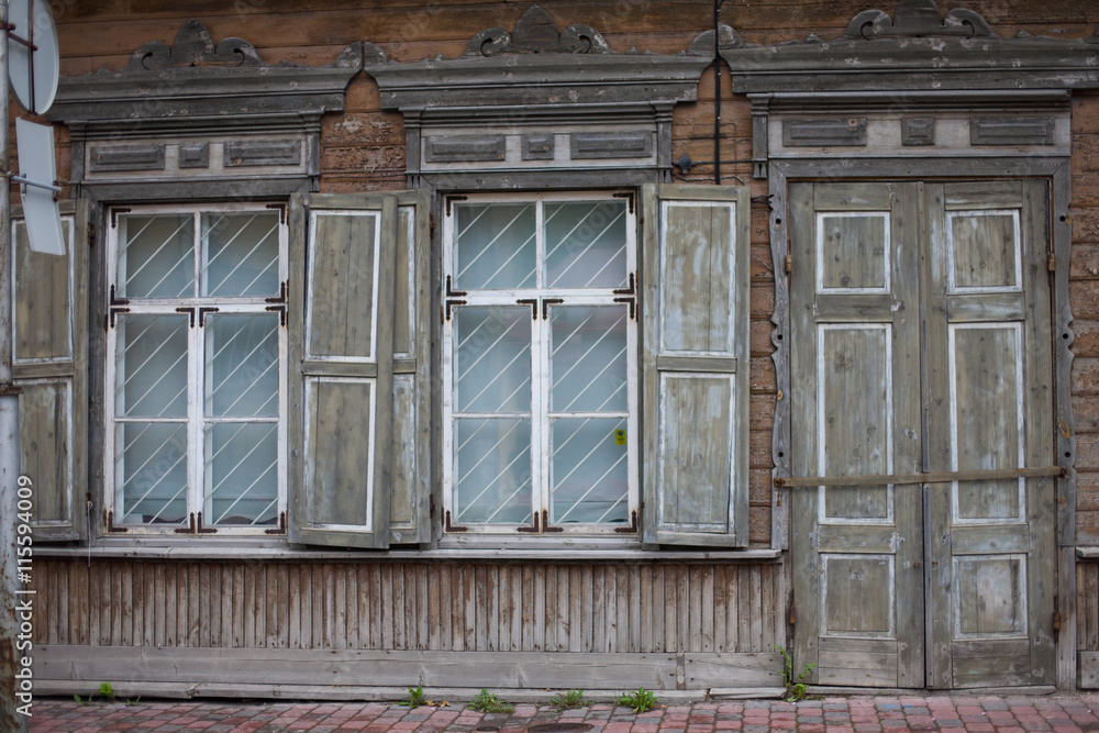 Old wooden and weathered town house facade