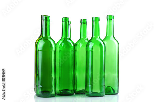 green glass bottles on white isolated background