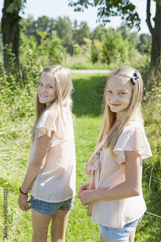 Sweden, Gotland, Eksta, View of two girls (12-13 years) in footpath photo