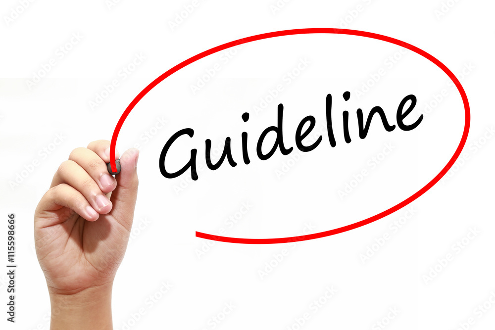Man Hand writing Guideline with marker on transparent wipe board. Business, internet, technology concept. Man Hand writing Guideline with marker on transparent wipe board. Business, internet, technology concept.