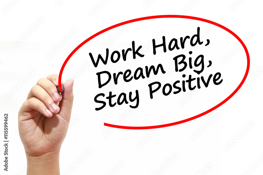 Man writing Work Hard, Dream Big, Stay Positive with marker on transparent wipe board. Man writing Work Hard, Dream Big, Stay Positive with marker on transparent wipe board.