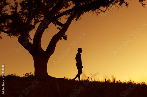 young man walking alone in nature. 