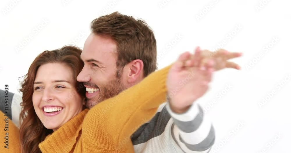Smiling young couple embracing on white background Smiling young couple embracing on white background