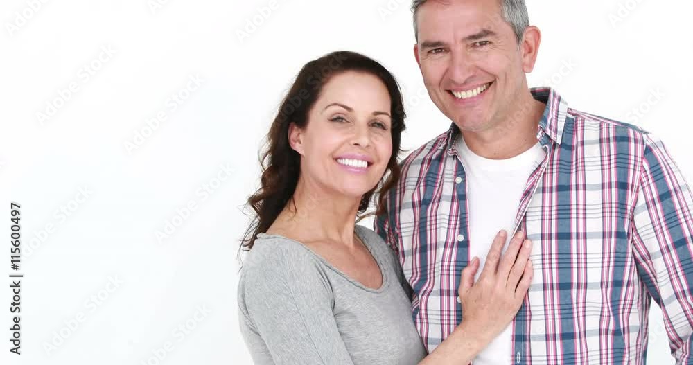 Smiling old couple embracing on white background Smiling old couple embracing on white background