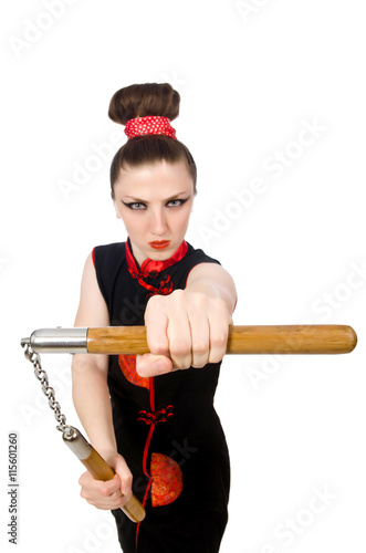 Funny woman with nunchucks isolated on white