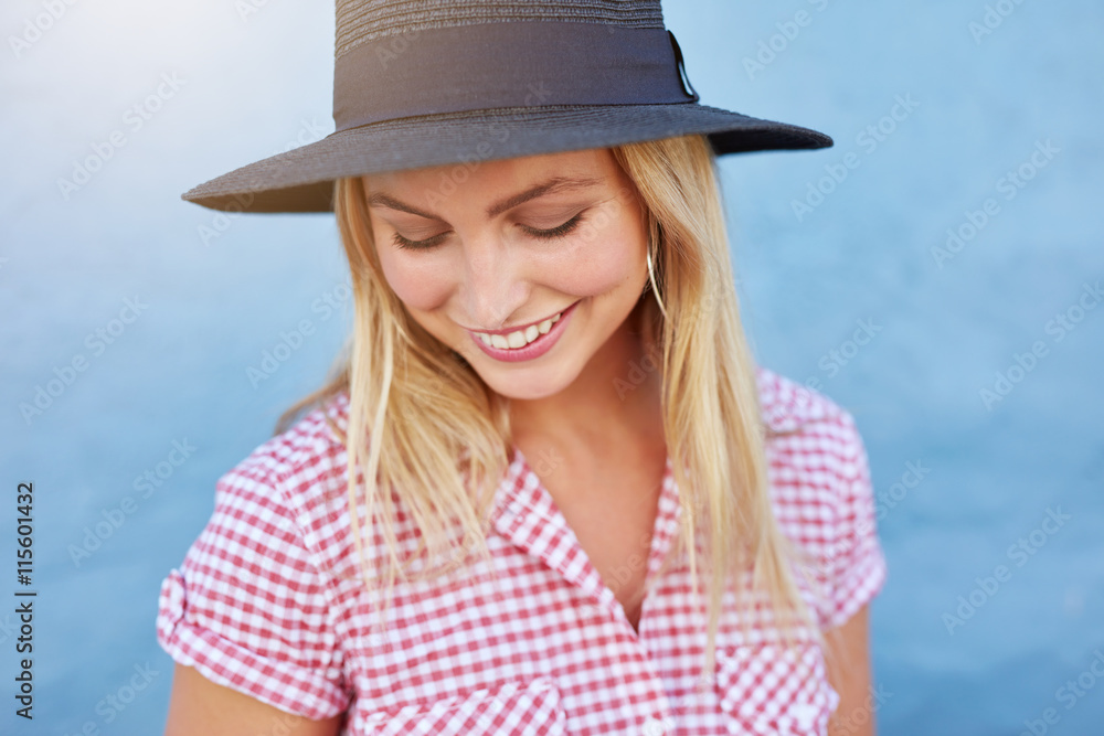 Beautiful young woman with hat