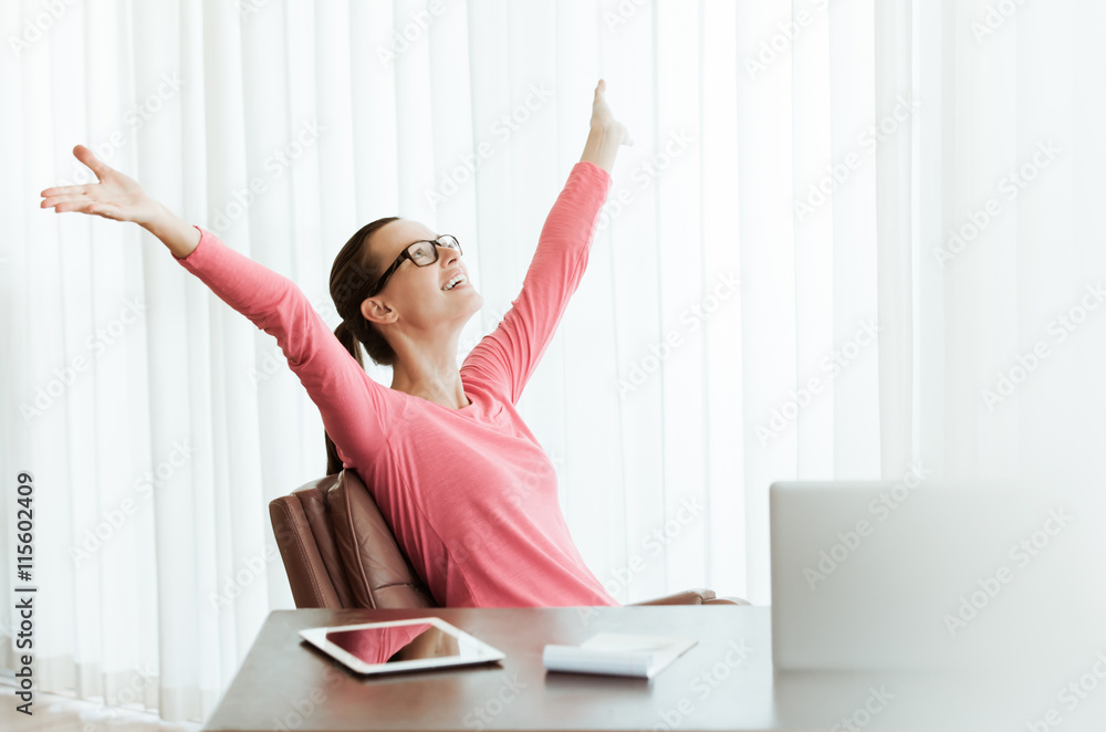 Happy successful businesswoman celebrating at work. Happy successful businesswoman celebrating at work.