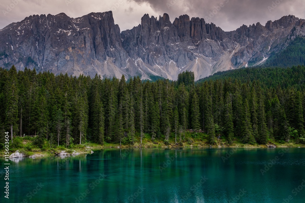 Amazing view of Lago di Carezza with wild mountain forest, Trentino-Alto Adige, Italia.