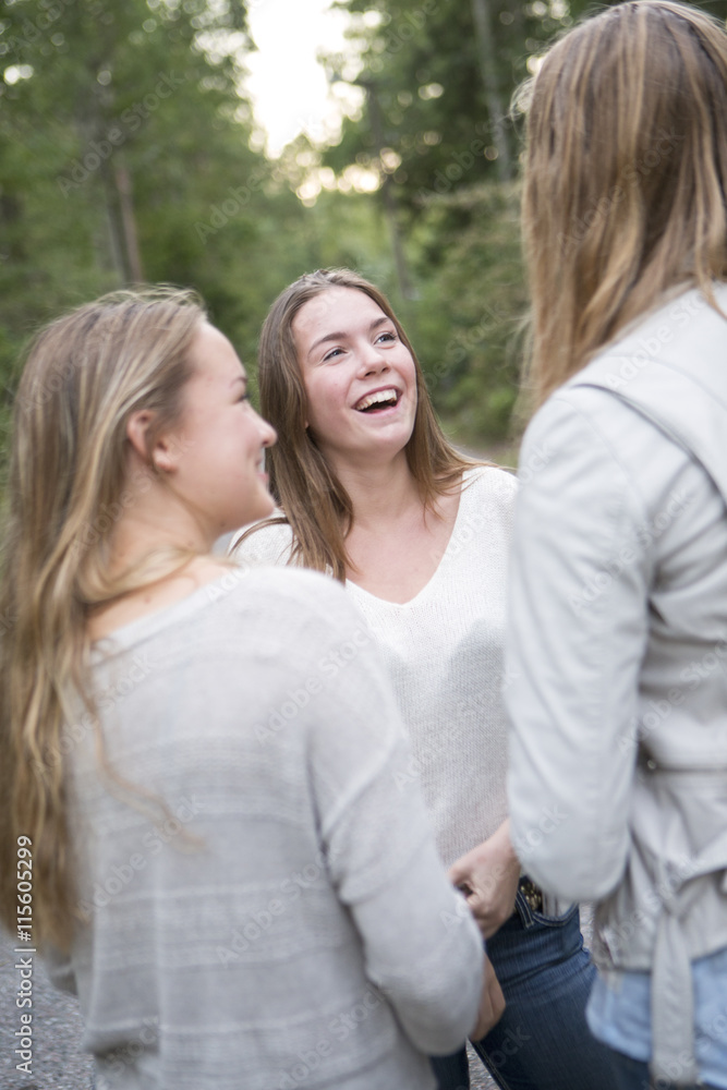 Sweden, Sodermanland, Nacka, Girls (14-15) talking and laughing Sweden, Sodermanland, Nacka, Girls (14-15) talking and laughing