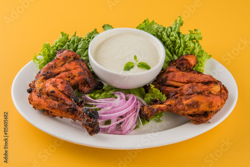 tandoori chicken leg, Tandoori Chicken , Indian spicy food, Delicious Tandoori chicken leg piece with Salad, India photo