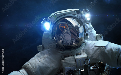 Fototapeta Naklejka Na Ścianę i Meble -  Astronaut in outer space. Spacewalk. Elements of this image furnished by NASA