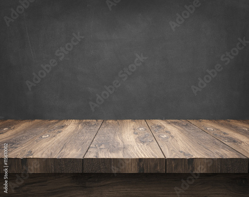 rustic wooden table with blackboard photo