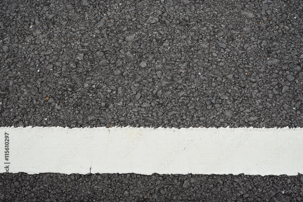 Fototapeta premium Asphalt road with white dividing stripes.