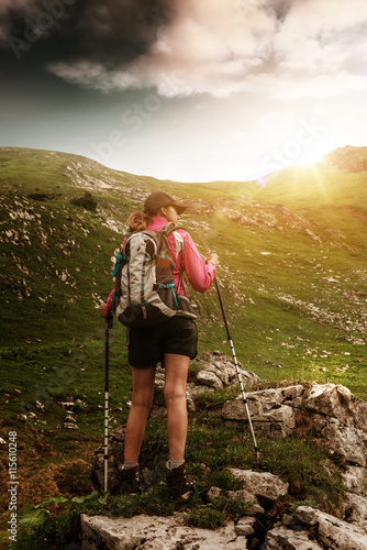 Woman trekking in the Alps with a backpack