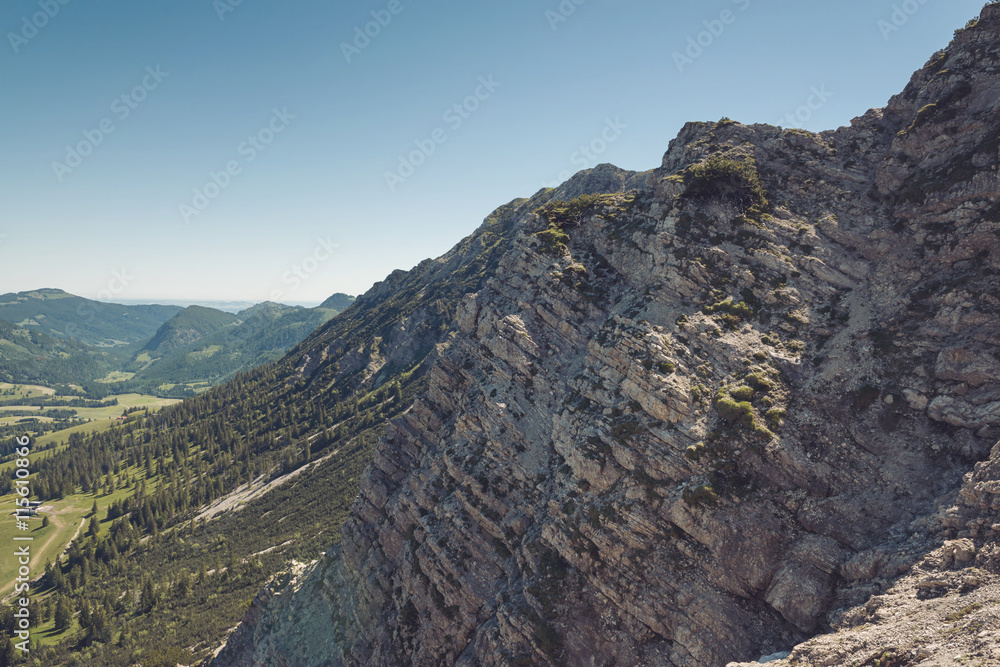 View from above on rocky cliffs near Alps