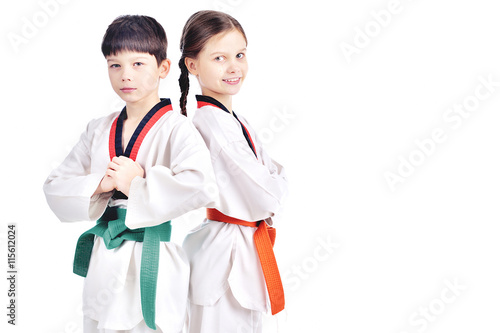 Two children athletes martial art taekwondo training photo