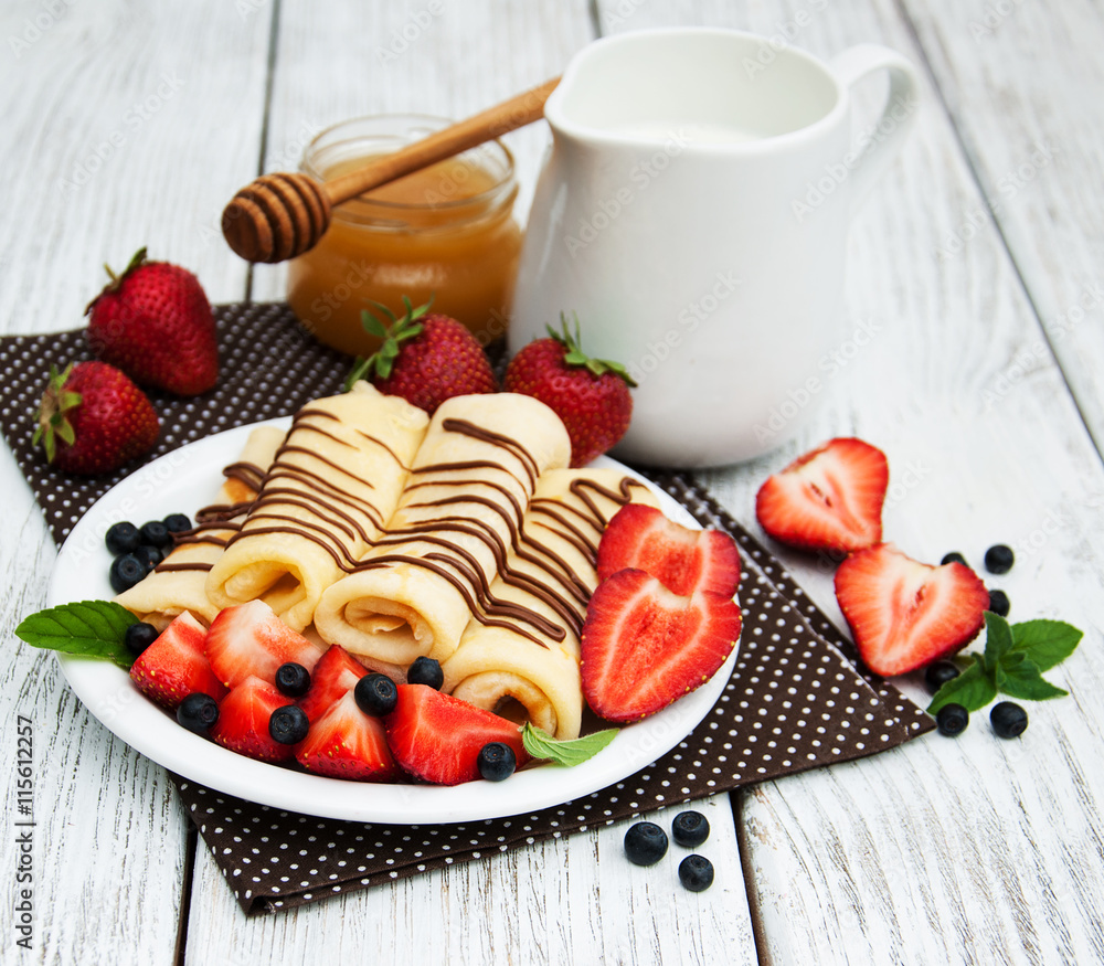 crepes with strawberries and chocolate sauce crepes with strawberries and chocolate sauce