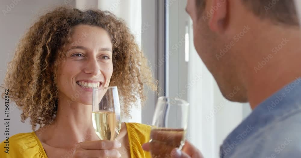 Smiling couple drinking glass of champagne Smiling couple drinking glass of champagne