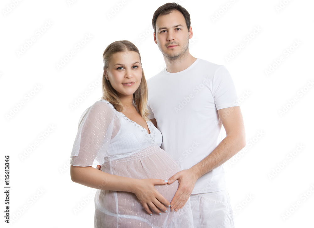 Portrait of happy couple waiting for a baby. Attractive man and woman on a white background. Pregnancy, family, childbirth Portrait of happy couple waiting for a baby. Attractive man and woman on a white background. Pregnancy, family, childbirth