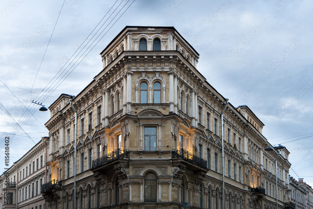 Classic corner building with balconies and columns on Voznesensky Prospect