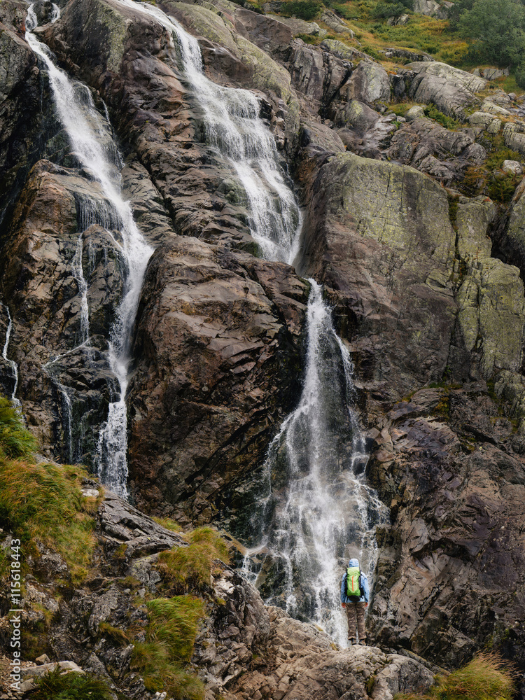 Fototapeta premium Woman near Siklawa waterfall in Tatra mountains