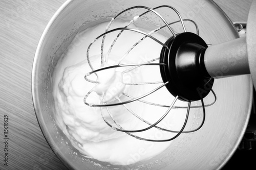 The process of whipping egg whites in a planetary mixer. Selecti