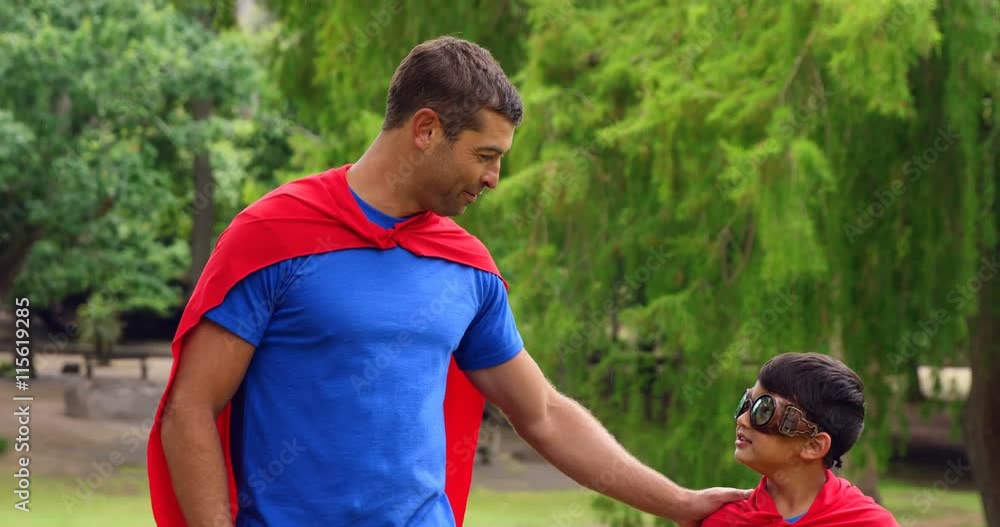 Father and son pretending to be superhero Father and son pretending to be superhero
