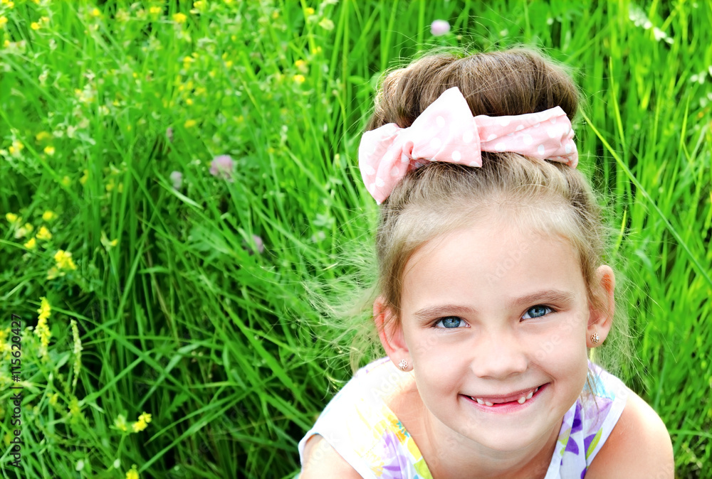 Adorable smiling little girl on the meadow in summer day Adorable smiling little girl on the meadow in summer day