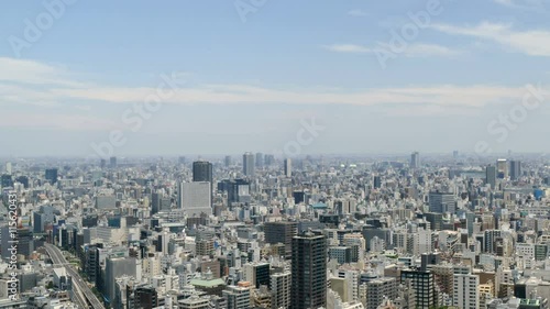 Wallpaper Mural Elevated timelapse of Tokyo skyline in summer skies. Torontodigital.ca