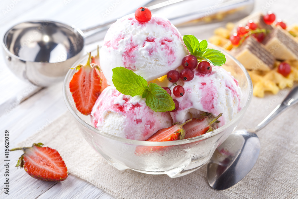 Ice Cream with Strawberry, Mint and waffles. Homemade product. On the wooden table. Ice Cream with Strawberry, Mint and waffles. Homemade product. On the wooden table.
