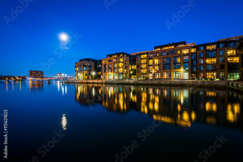 The full moon over a waterfront apartment building in Fells Poin © jonbilous