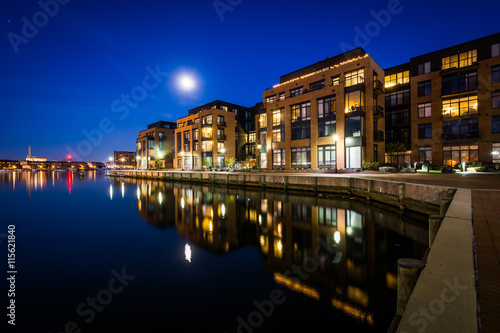 The full moon over a waterfront apartment building in Fells Poin © jonbilous