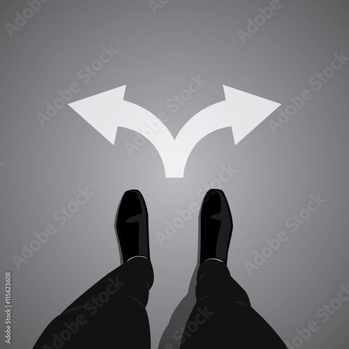 Businessman standing at the cross road