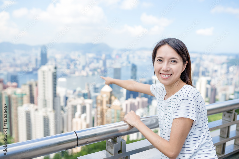 Woman pointing the location in Hong Kong