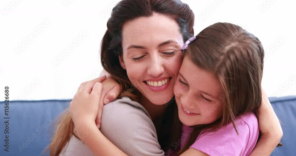 Mom and daughter cuddling at home Mom and daughter cuddling at home