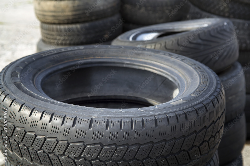 Erased automobile tires background. Structure of a tread of rubber. Erased automobile tires background. Structure of a tread of rubber.