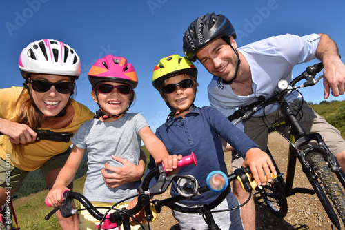 Portrait of happy family on a biking day