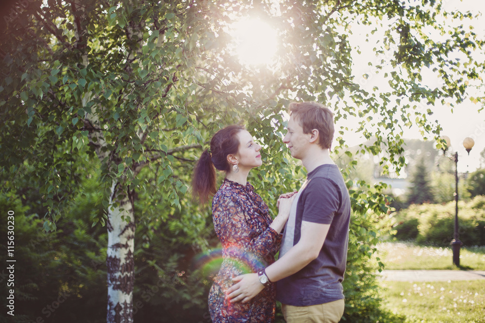Happy couple in love walking in park Happy couple in love walking in park