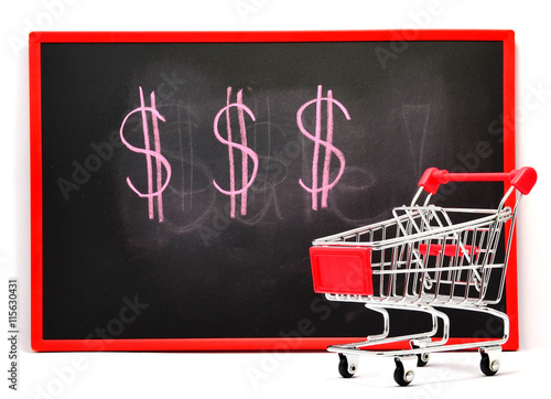 Shopping cart with chalk written currency symbol on black board