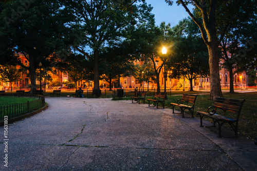 Walkway and benches at Logan Circle at night, in Washington, DC.
