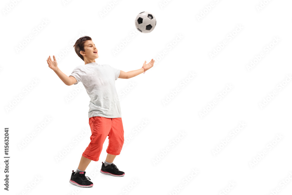 Kid waiting a football on his chest