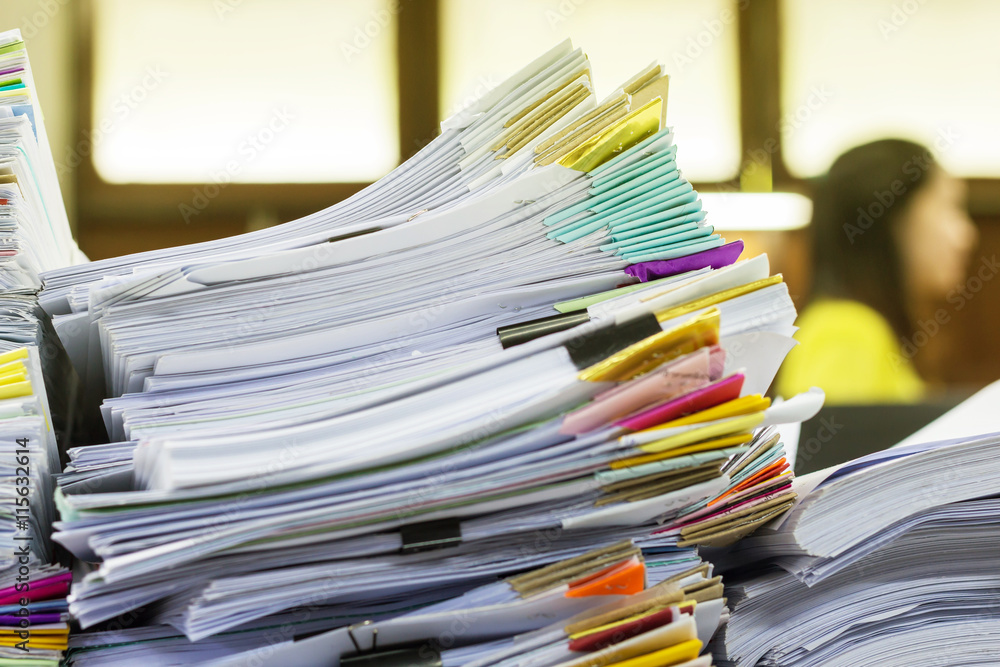 Stack of business report paper files with black clips Stack of business report paper files with black clips