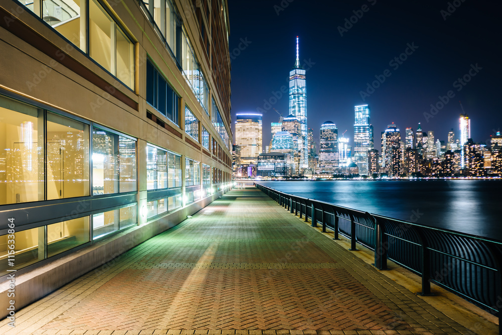 Waterfront walkway and view of the Lower Manhattan skyline at ni