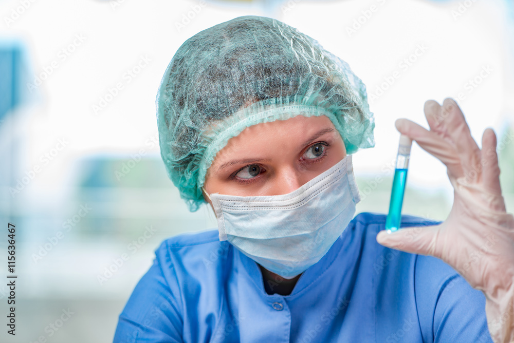 Experienced lab assistant working on chemical solutions Experienced lab assistant working on chemical solutions