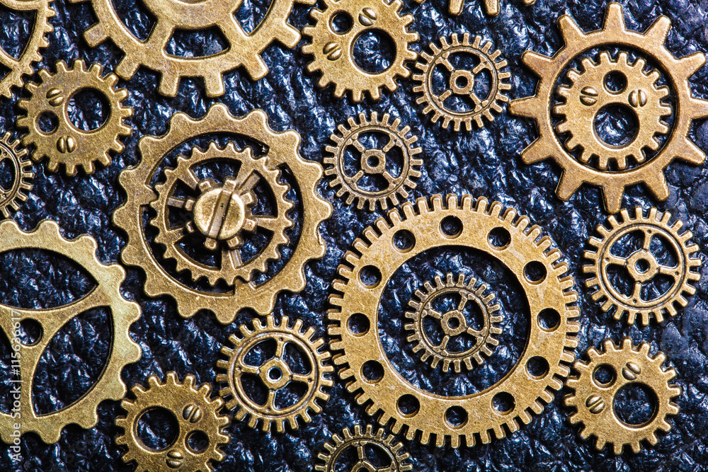 steampunk mechanical cogs gears wheels on leather background