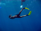Diver swimming with snorkel in the sea