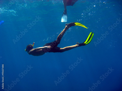 Diver swimming with snorkel in the sea