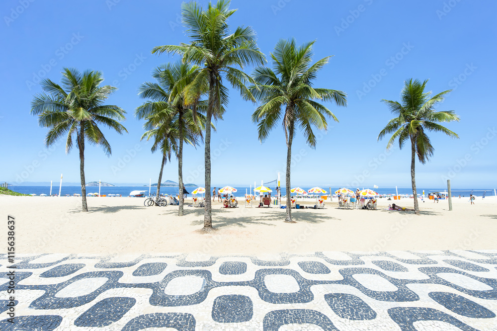 Photo & Art Print Classic empty view of the Ipanema Beach boardwalk with  palm trees and blue sky a